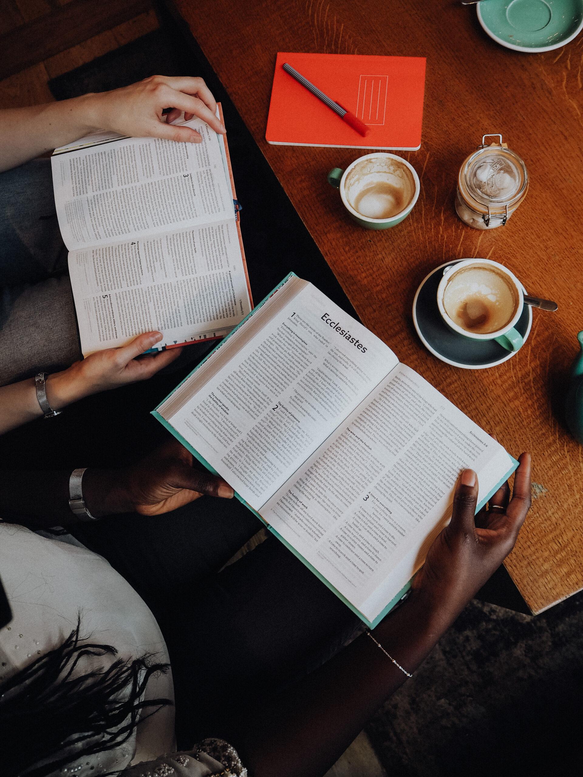 Members of The Hungry Seekers Bible Study Group reading and discussing Scripture together in a welcoming fellowship setting